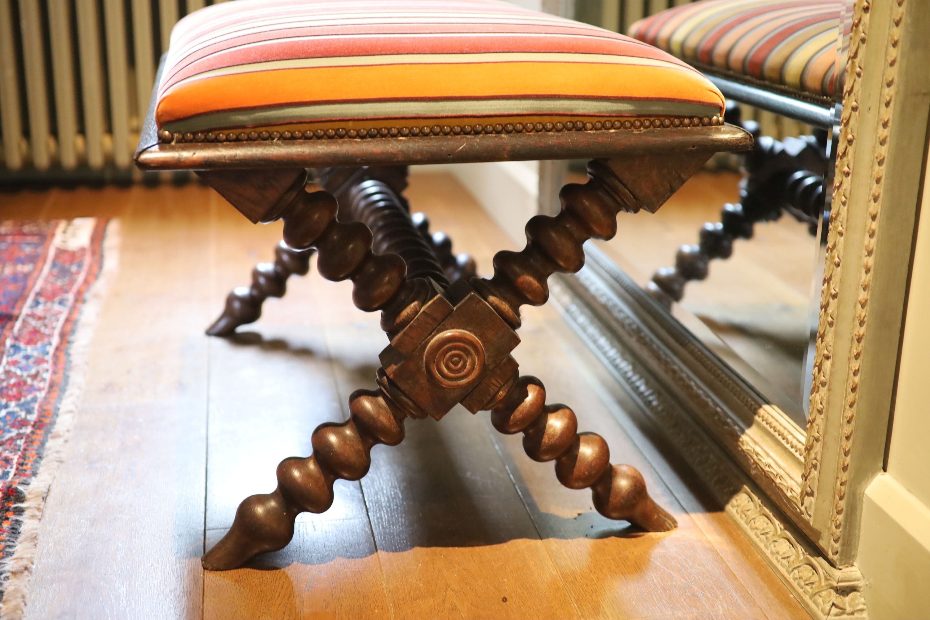 A Victorian stained oak stool, with striped upholstery and turned underframe, 90 x 60cm height 53cm